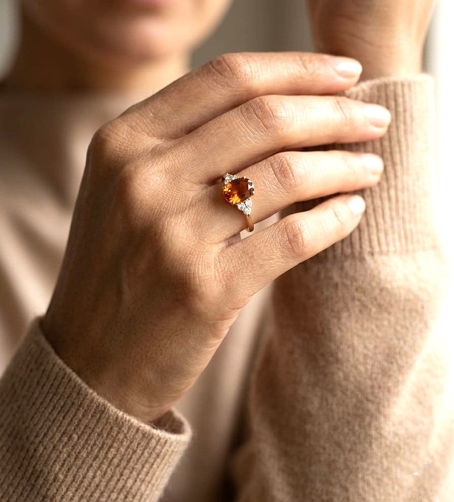 Oval citrine and diamond ring in 18K yellow gold with natural citrine center stone and diamond side accents