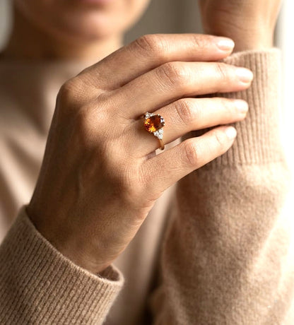 Oval citrine and diamond ring in 18K yellow gold with natural citrine center stone and diamond side accents