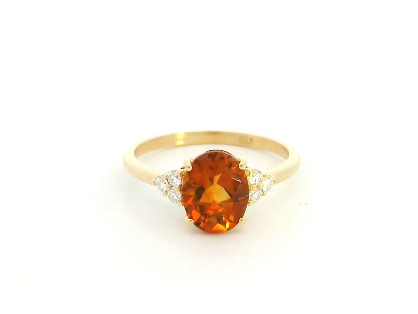 Oval citrine and diamond ring in 18K yellow gold with natural citrine center stone and diamond side accents