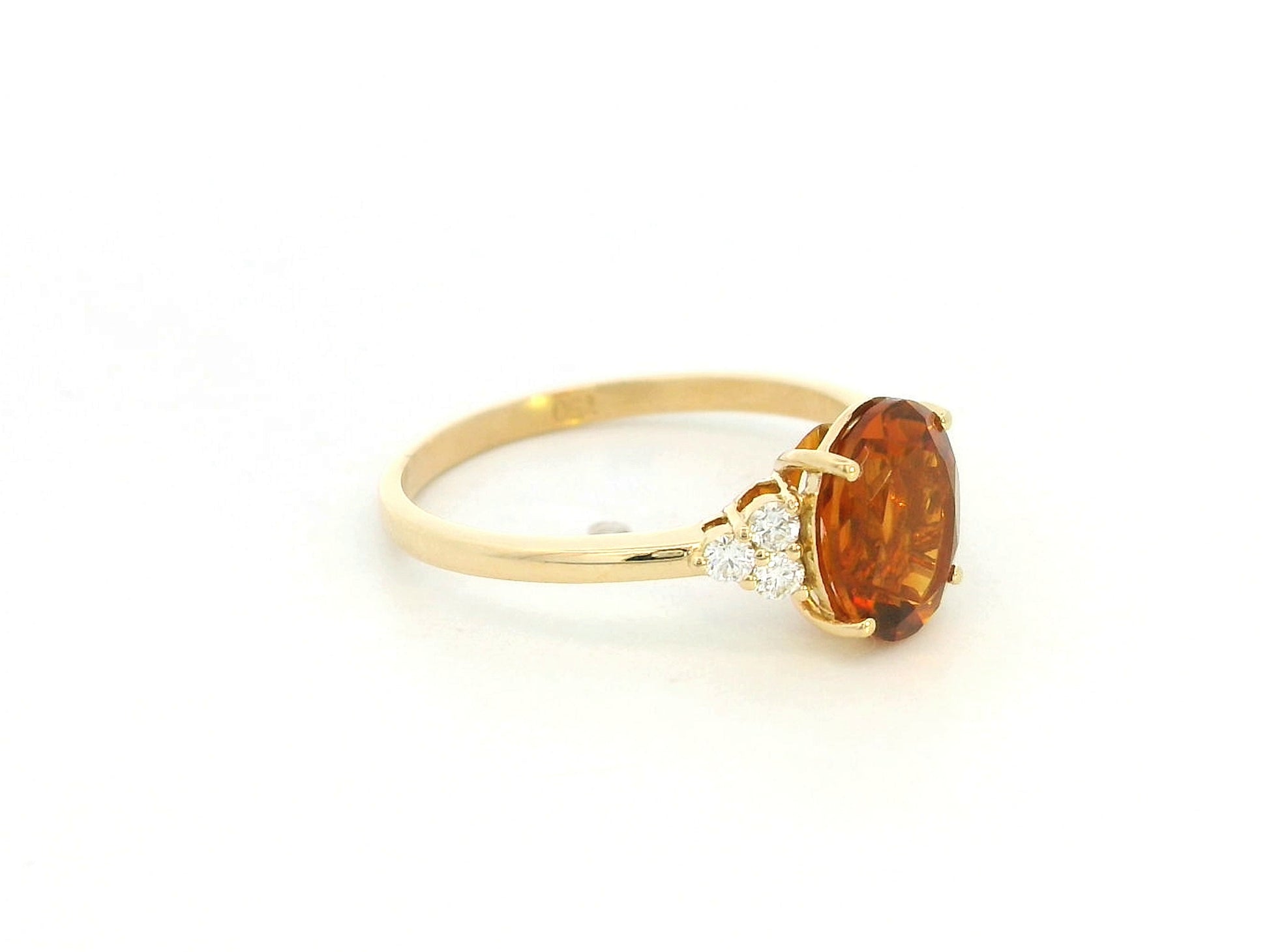 Oval citrine and diamond ring in 18K yellow gold with natural citrine center stone and diamond side accents