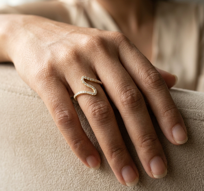 18K yellow gold wave diamond ring featuring 0.55 carat natural diamonds in a modern open curved design.