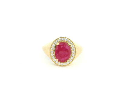 Men’s ruby and diamond ring in 18K yellow gold with oval ruby center stone and diamond halo