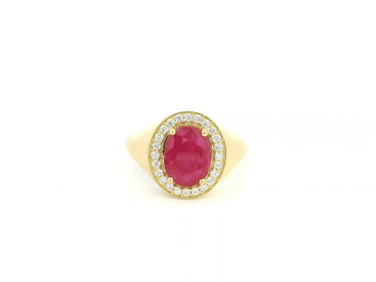Men’s ruby and diamond ring in 18K yellow gold with oval ruby center stone and diamond halo