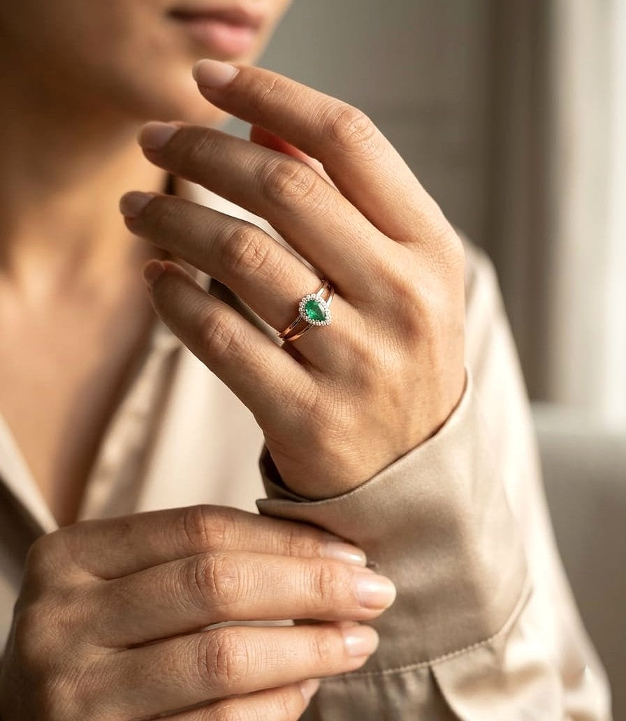 Pear emerald and diamond ring in 18K rose gold with open split band design
