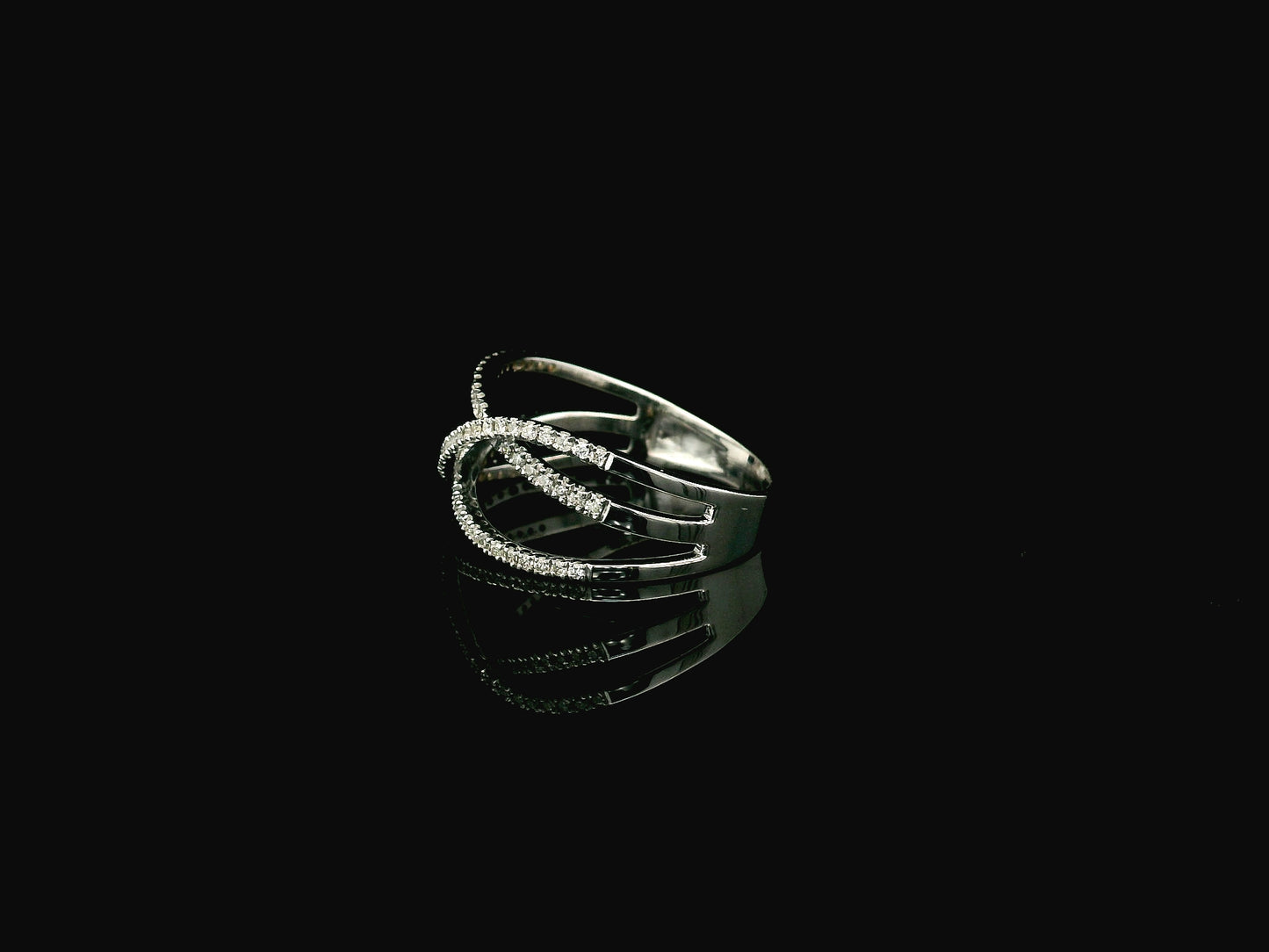 18K white gold diamond criss cross ring with pavé-set crossover bands.