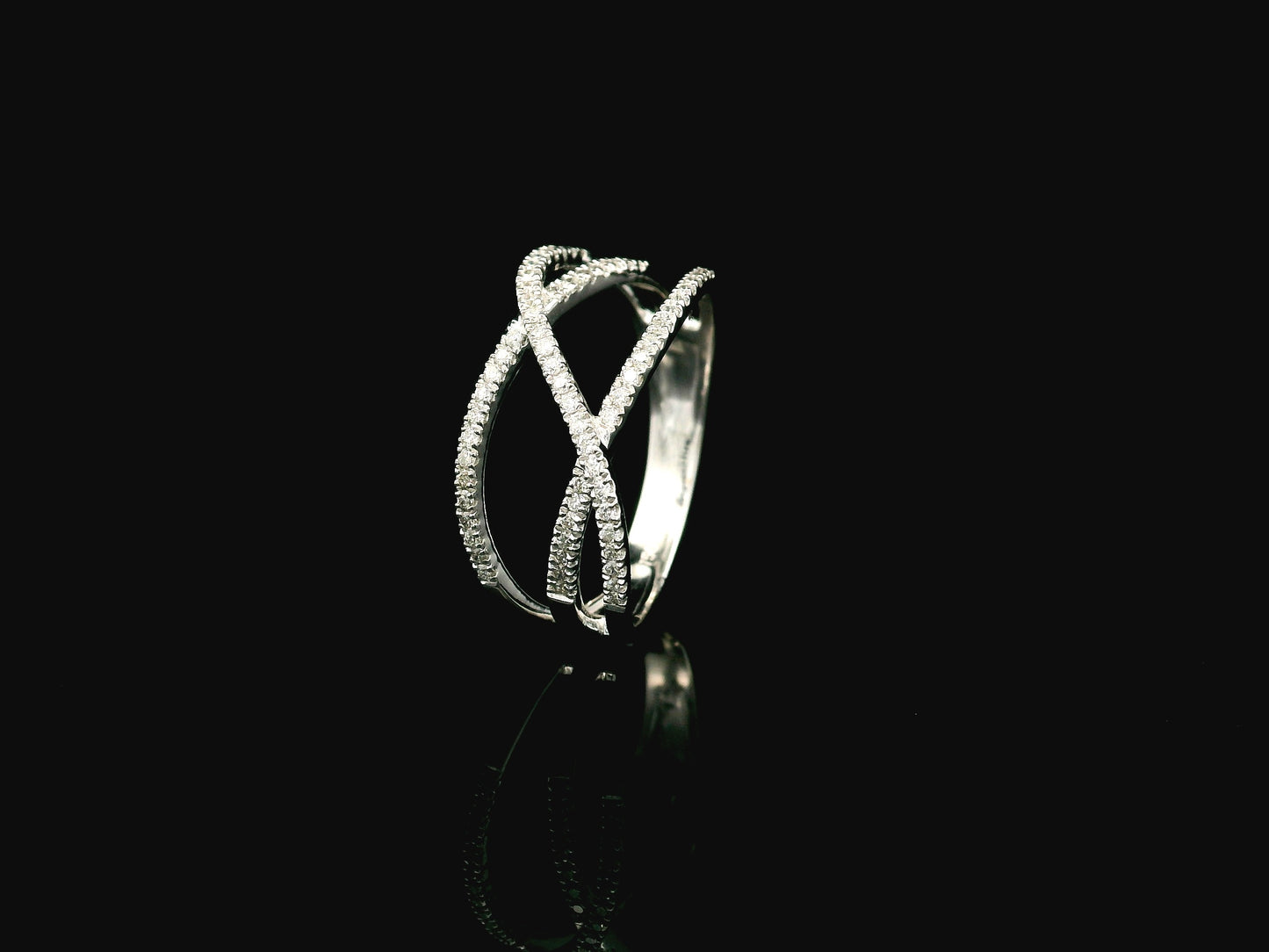 18K white gold diamond criss cross ring with pavé-set crossover bands.