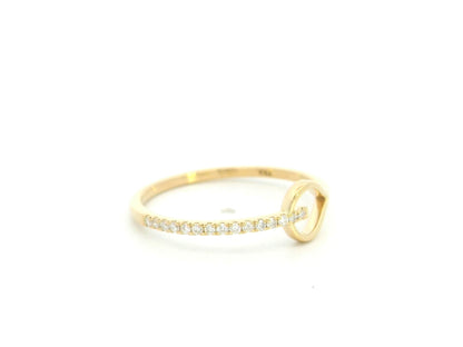 18K yellow gold open teardrop diamond ring with minimalist modern design.