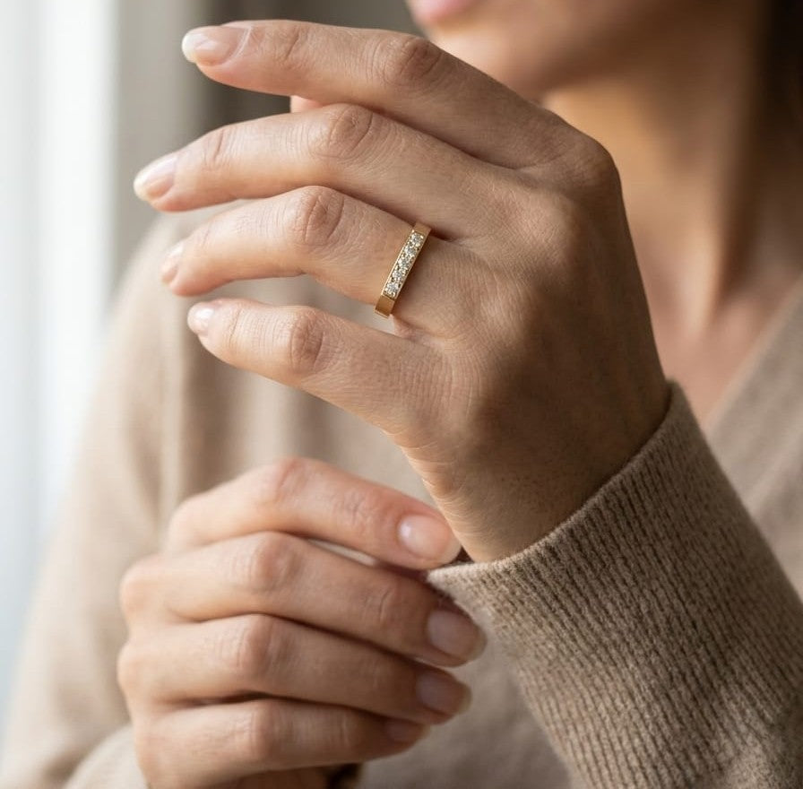 18K yellow gold diamond bar band ring with modern minimalist design.