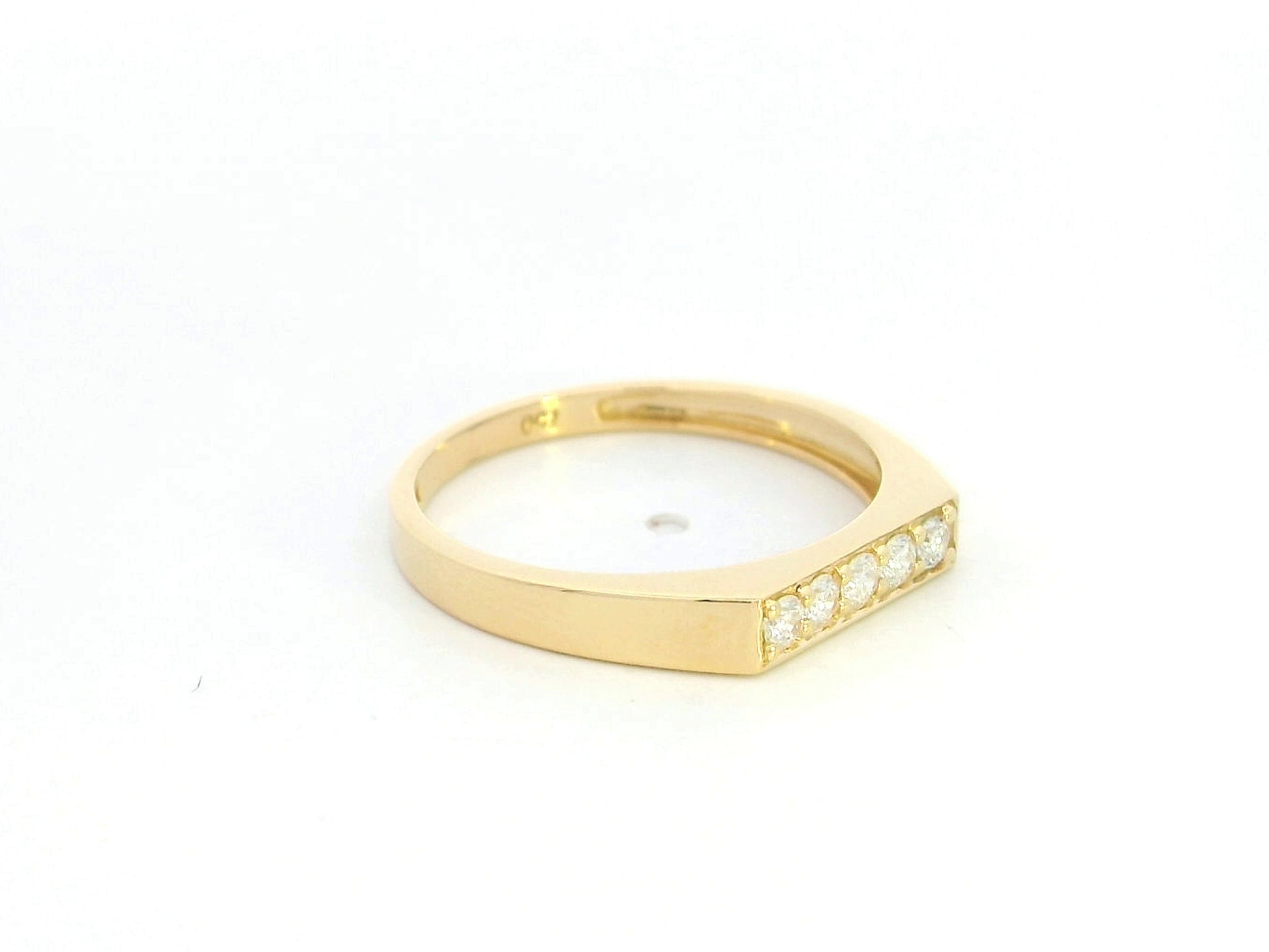 18K yellow gold diamond bar band ring with modern minimalist design.