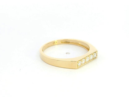 18K yellow gold diamond bar band ring with modern minimalist design.