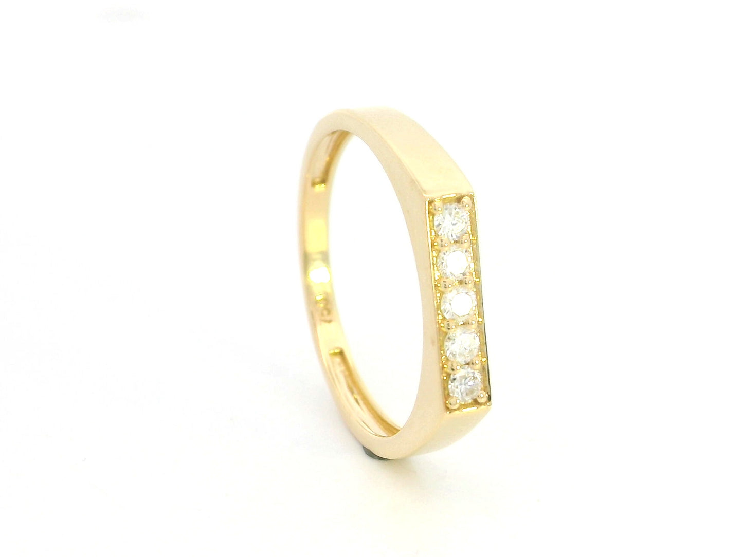 18K yellow gold diamond bar band ring with modern minimalist design.
