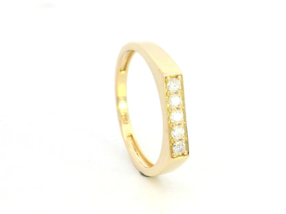 18K yellow gold diamond bar band ring with modern minimalist design.