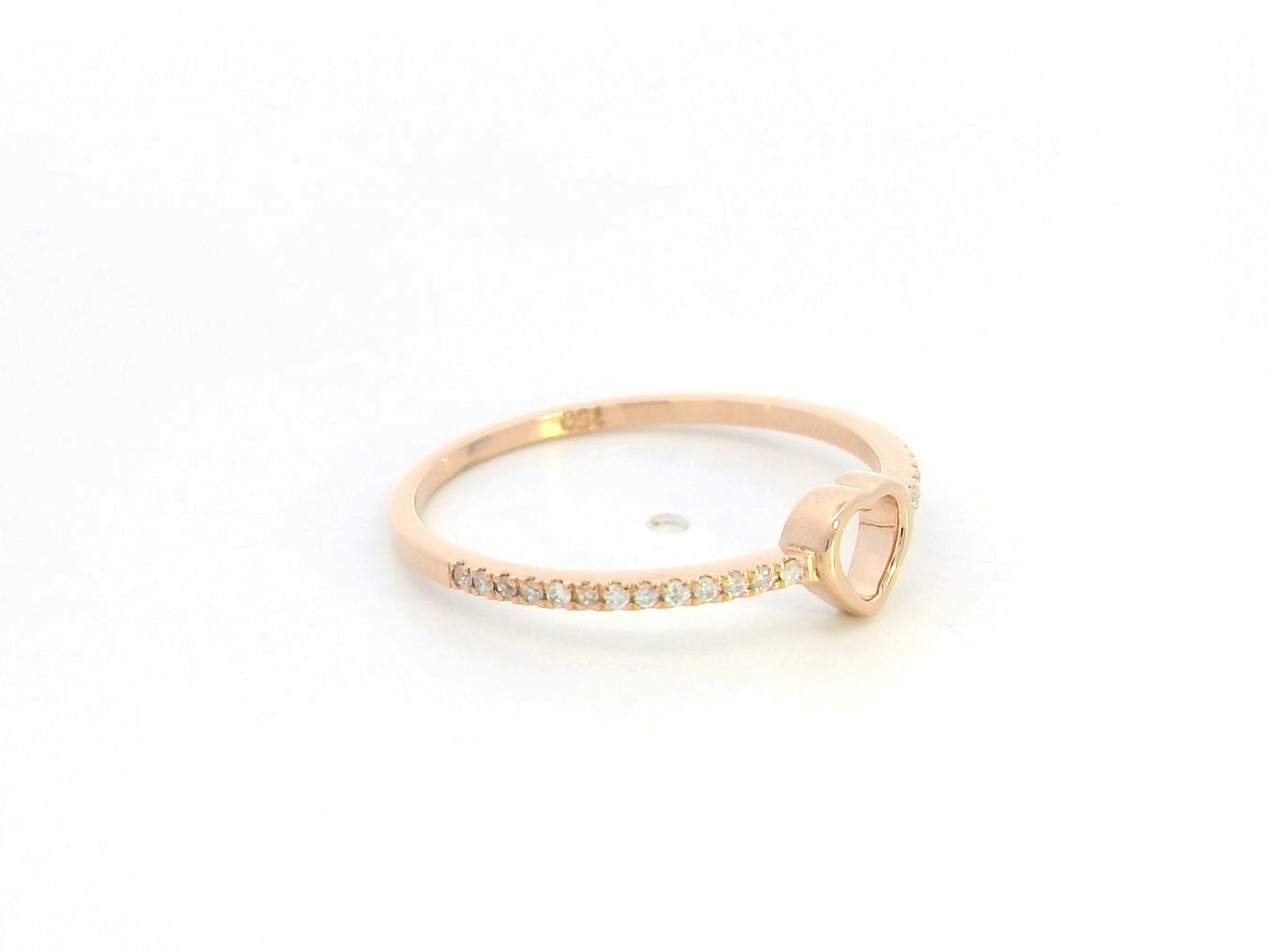 18K rose gold diamond heart ring with pavé-set diamonds and minimalist open heart design.