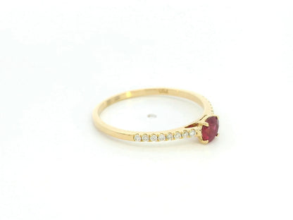 Ruby and diamond solitaire ring in 18K yellow gold featuring a 0.36 carat natural ruby and 0.11 carat diamonds