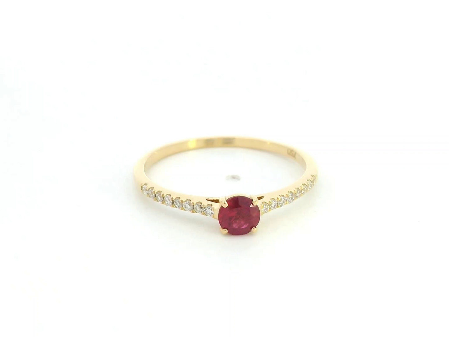 Ruby and diamond solitaire ring in 18K yellow gold featuring a 0.36 carat natural ruby and 0.11 carat diamonds