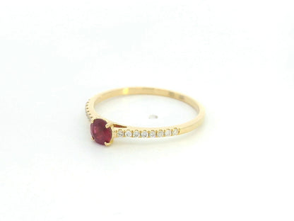 Ruby and diamond solitaire ring in 18K yellow gold featuring a 0.36 carat natural ruby and 0.11 carat diamonds