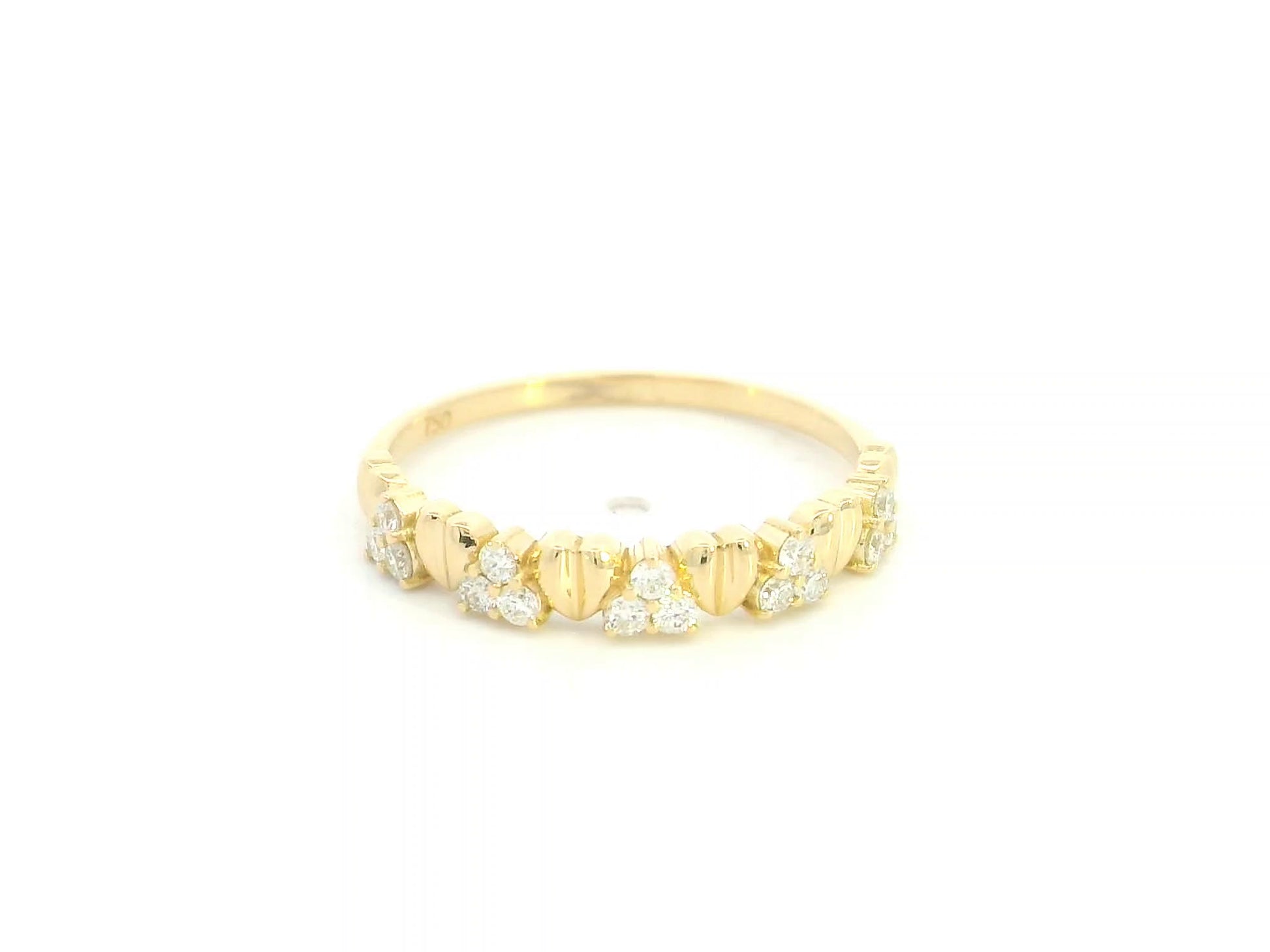 18K yellow gold diamond heart ring featuring alternating heart motifs and diamond clusters with a total diamond weight of 0.21 carat.