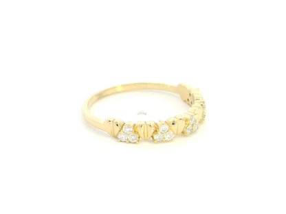 18K yellow gold diamond heart ring featuring alternating heart motifs and diamond clusters with a total diamond weight of 0.21 carat.