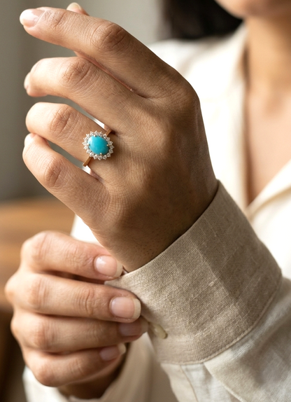 18K yellow gold turquoise and diamond halo ring with oval cabochon gemstone