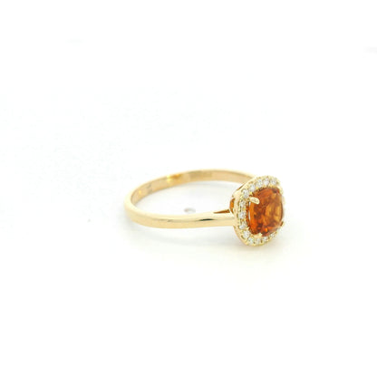Cushion cut citrine halo ring in 18K yellow gold with diamond accents