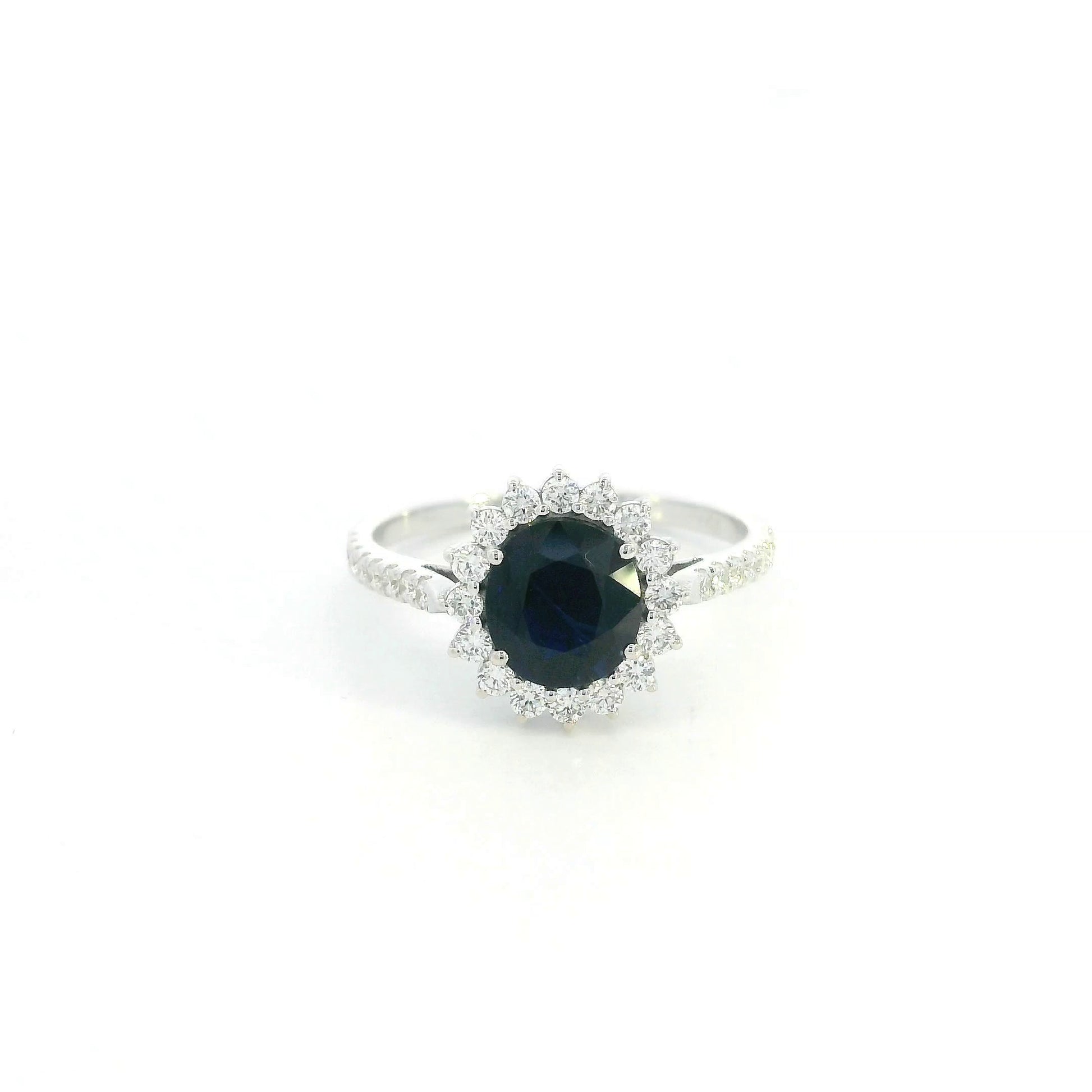 18K white gold blue sapphire and diamond halo ring with pavé diamond band
