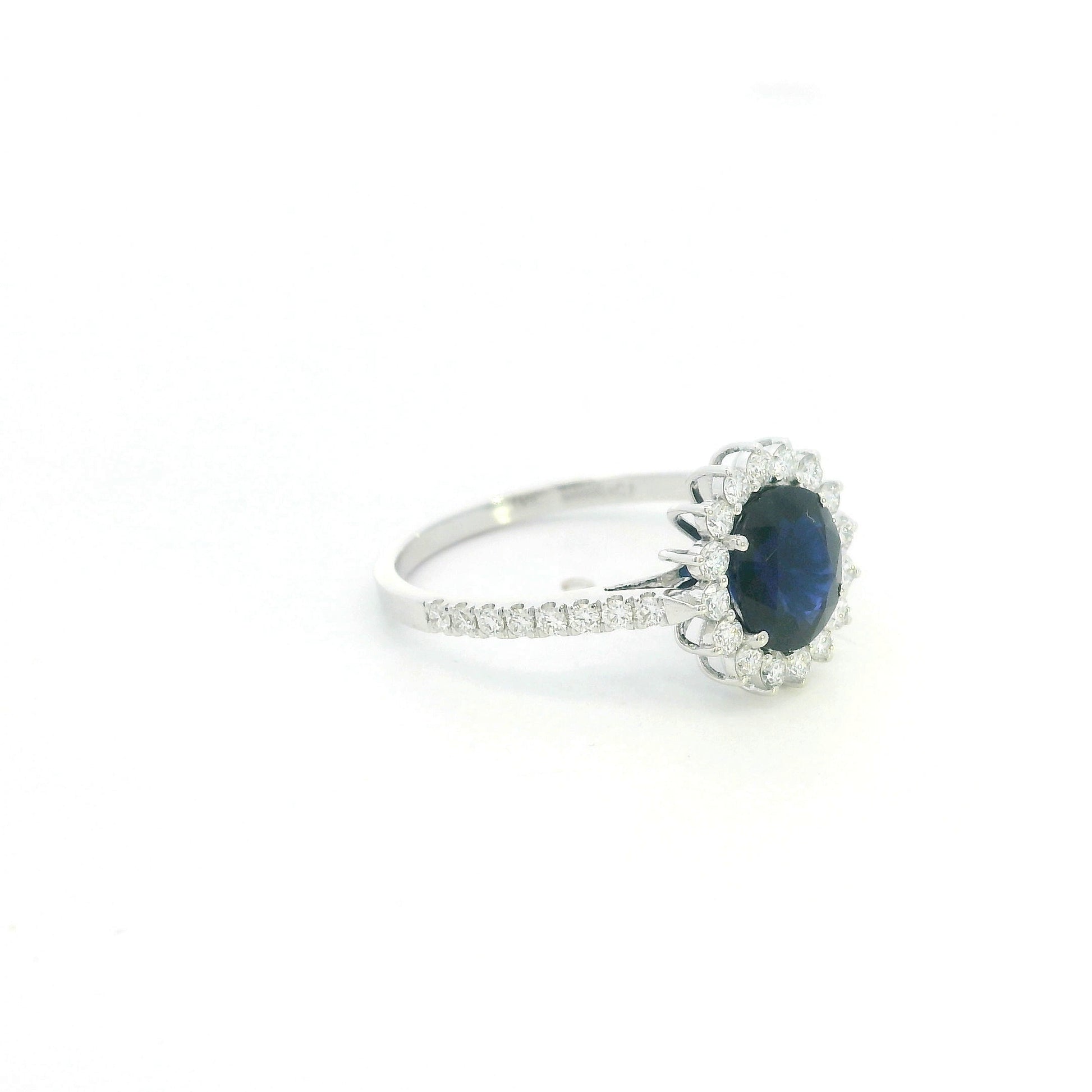 18K white gold blue sapphire and diamond halo ring with pavé diamond band