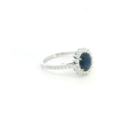 18K white gold blue sapphire and diamond halo ring with pavé diamond band
