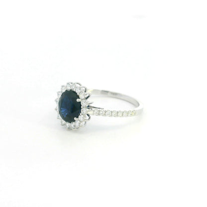 18K white gold blue sapphire and diamond halo ring with pavé diamond band