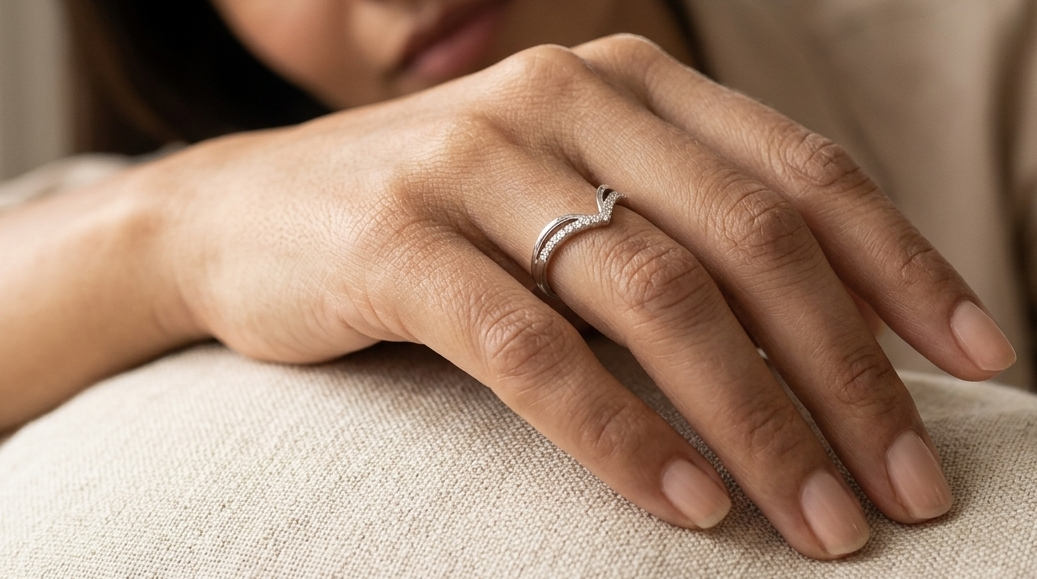 18K white gold chevron diamond ring featuring 0.10 carat natural diamonds in a V-shaped contour design.