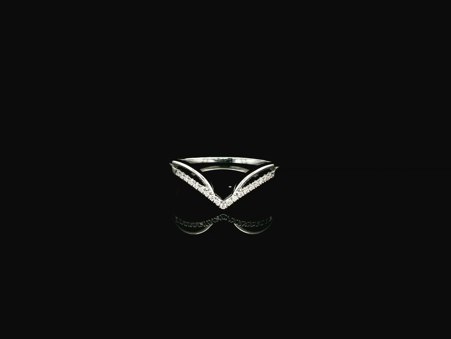 18K white gold chevron diamond ring featuring 0.10 carat natural diamonds in a V-shaped contour design.