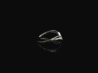 18K white gold chevron diamond ring featuring 0.10 carat natural diamonds in a V-shaped contour design.