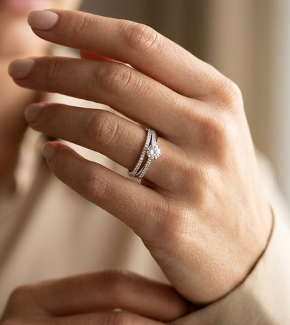 18K white gold diamond engagement ring featuring a 0.30 carat round center diamond and triple-row band with 0.28 carats of accent diamonds.