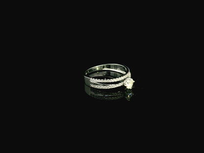 18K white gold diamond engagement ring featuring a 0.30 carat round center diamond and triple-row band with 0.28 carats of accent diamonds.