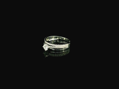 18K white gold diamond engagement ring featuring a 0.30 carat round center diamond and triple-row band with 0.28 carats of accent diamonds.