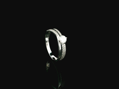 18K white gold diamond engagement ring featuring a 0.30 carat round center diamond and triple-row band with 0.28 carats of accent diamonds.