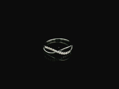 18K white gold diamond crossover ring featuring a crisscross design with 0.16 carat natural diamonds and polished white gold bands.