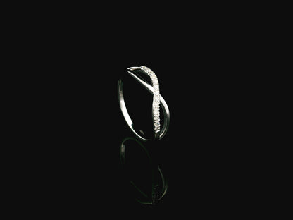 18K white gold diamond crossover ring featuring a crisscross design with 0.16 carat natural diamonds and polished white gold bands.