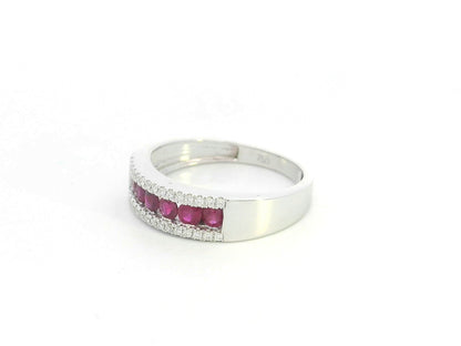 Ruby and diamond channel set ring in 18K white gold featuring 0.51 carat natural rubies and 0.12 carat diamonds