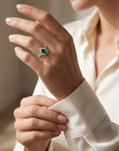 Pear shape emerald and diamond halo ring in 18K white gold by Emirates Diamonds