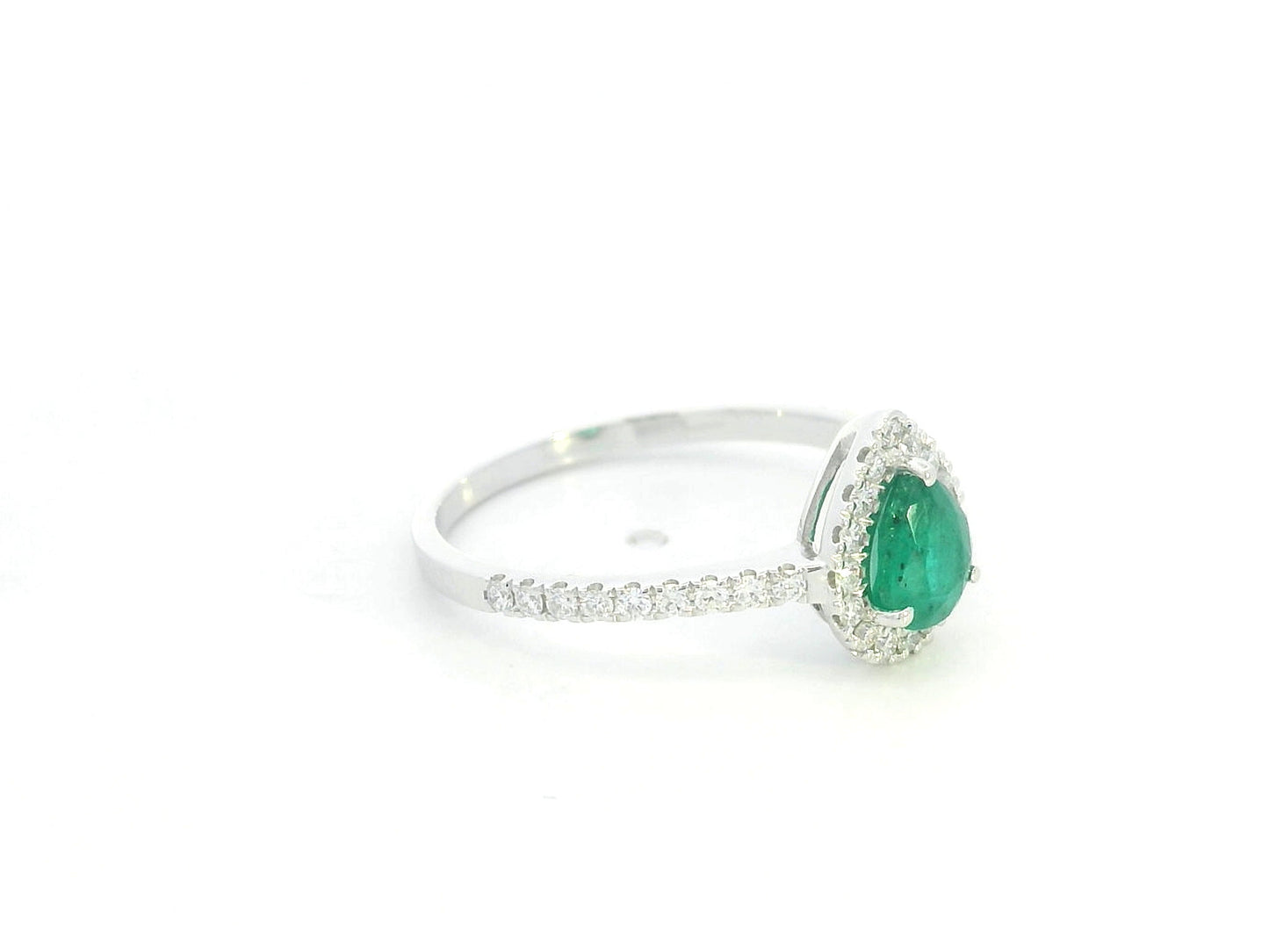 Pear shape emerald and diamond halo ring in 18K white gold by Emirates Diamonds
