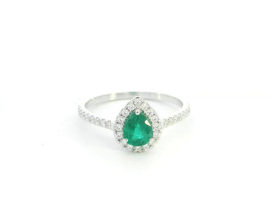 Pear shape emerald and diamond halo ring in 18K white gold by Emirates Diamonds
