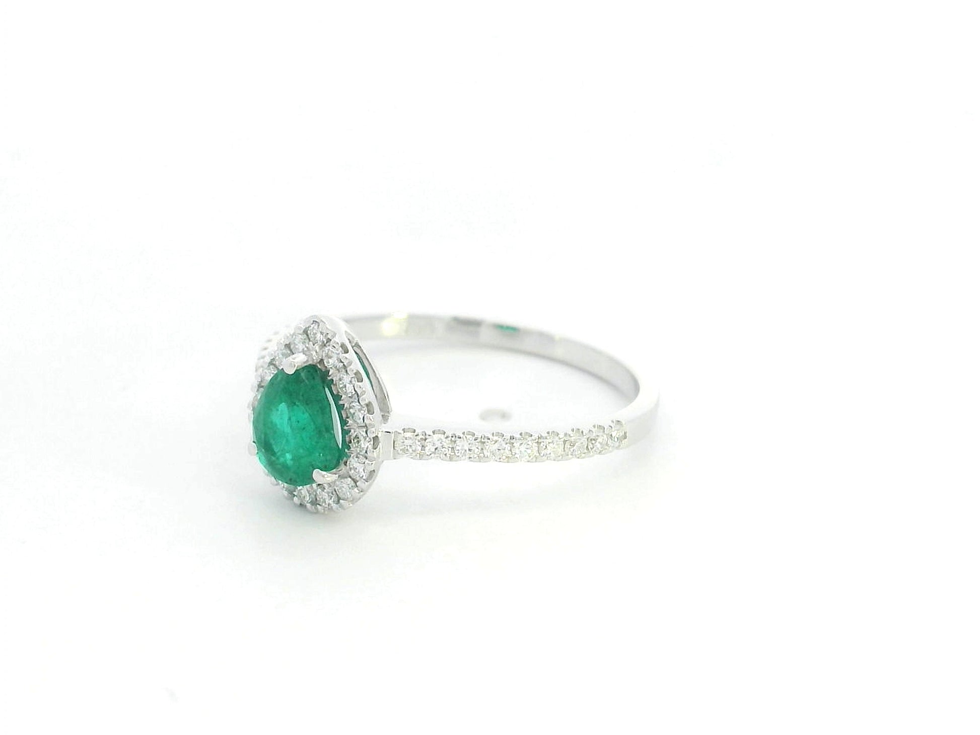 Pear shape emerald and diamond halo ring in 18K white gold by Emirates Diamonds