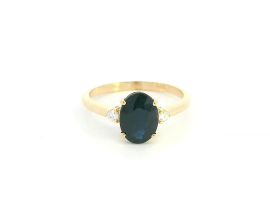 Oval sapphire and diamond ring in 18K yellow gold by Emirates Diamonds
