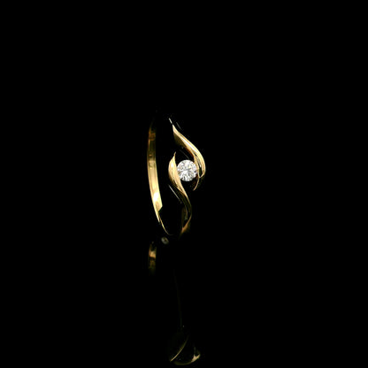Solitaire diamond twist ring in 18K yellow gold featuring a 0.10 carat natural diamond