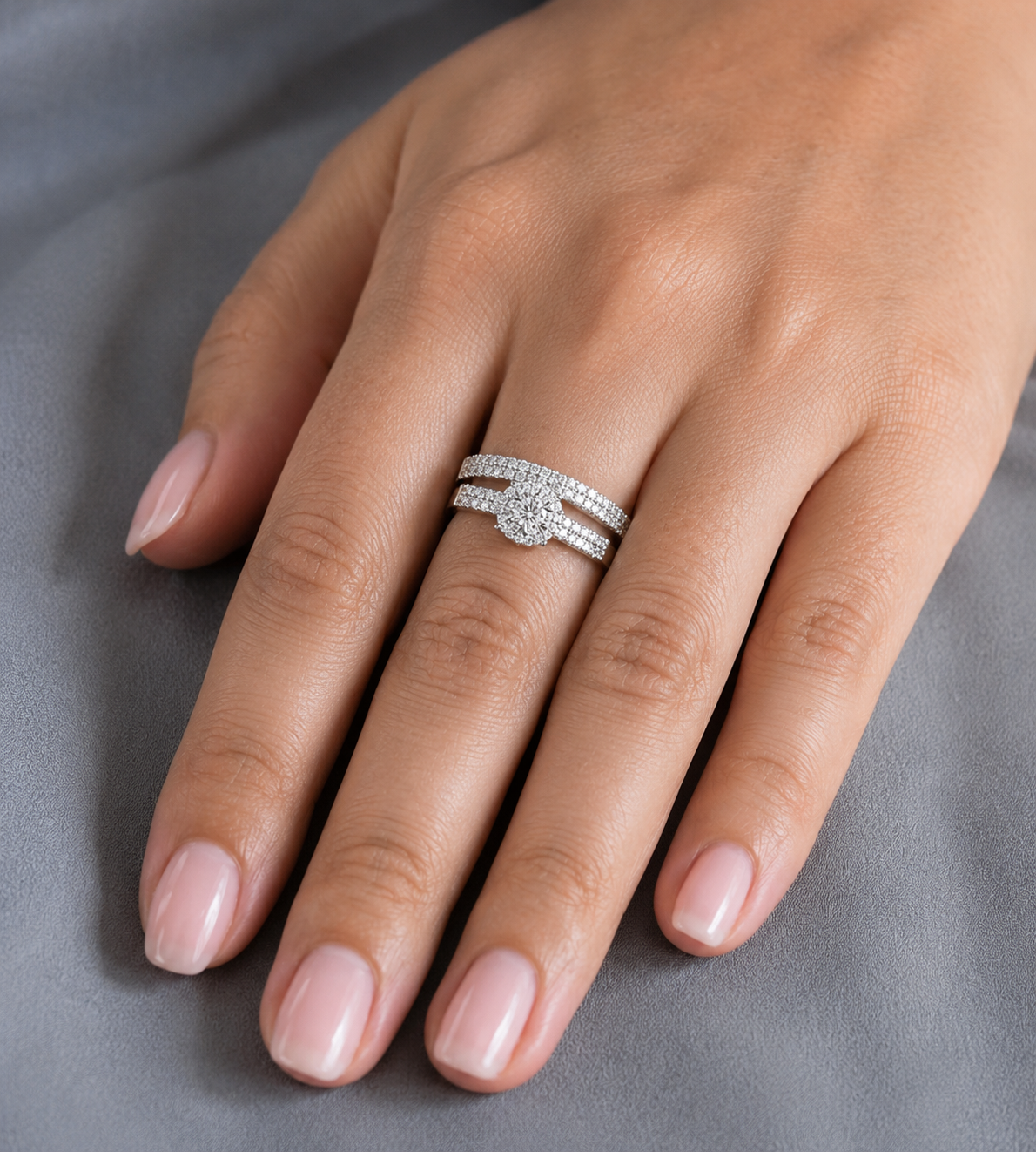 18K white gold diamond bridal set featuring a diamond cluster engagement ring and matching wedding band with 0.92 carat natural diamonds.