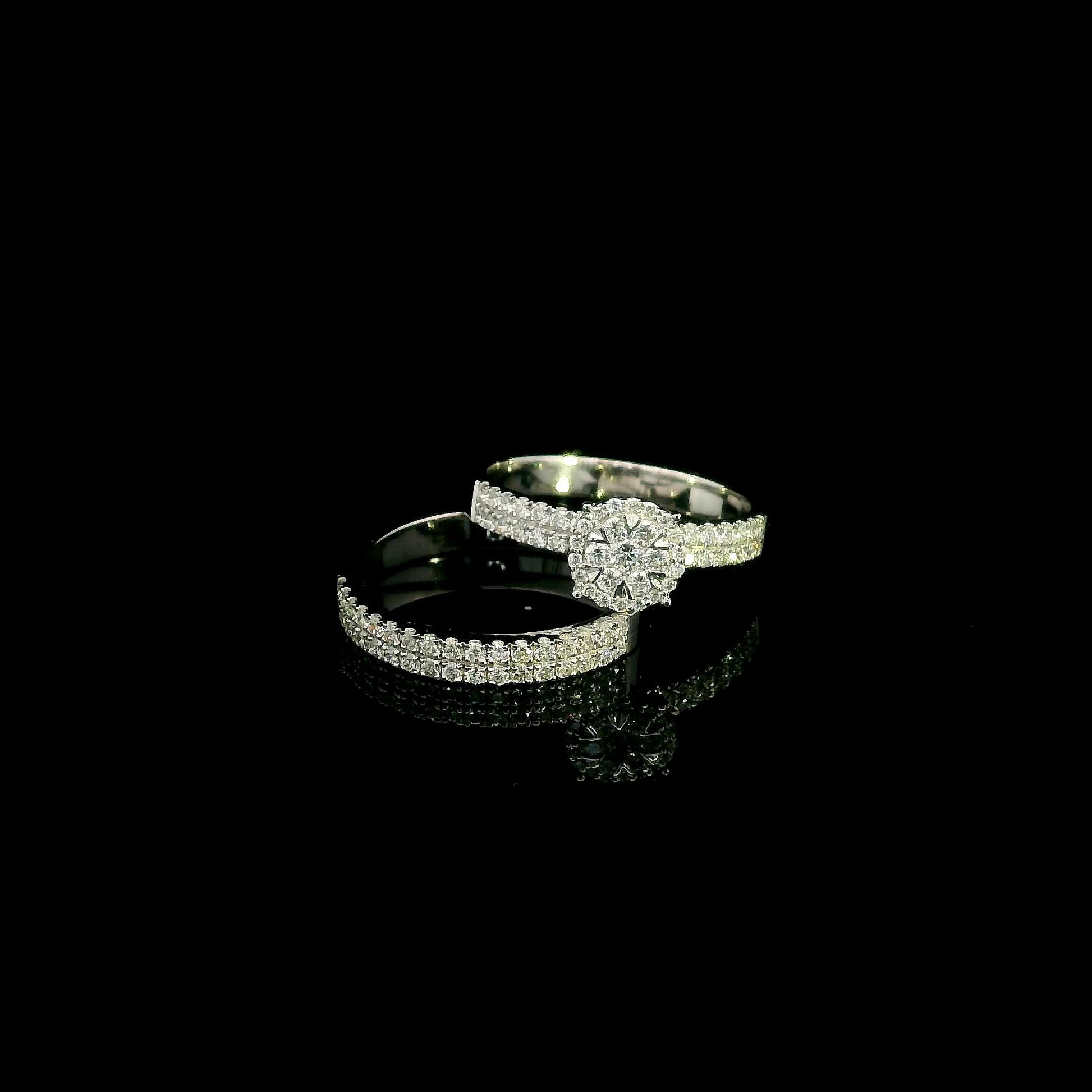 18K white gold diamond bridal set featuring a diamond cluster engagement ring and matching wedding band with 0.92 carat natural diamonds.