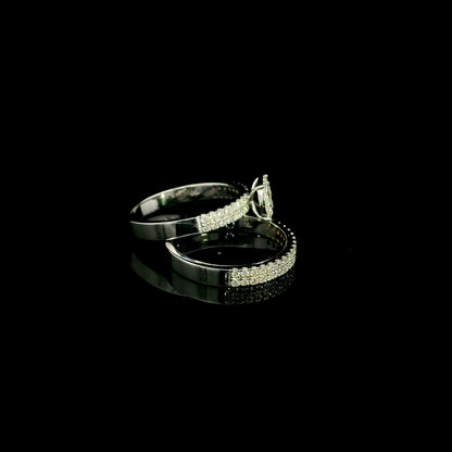18K white gold diamond bridal set featuring a diamond cluster engagement ring and matching wedding band with 0.92 carat natural diamonds.