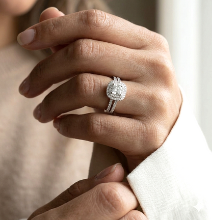 GIA certified cushion cut diamond bridal ring set in 18K white gold with halo engagement ring and matching diamond wedding band.