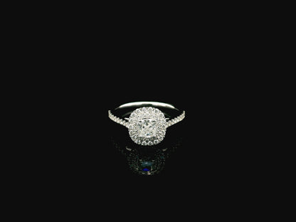 GIA certified cushion cut diamond bridal ring set in 18K white gold with halo engagement ring and matching diamond wedding band.
