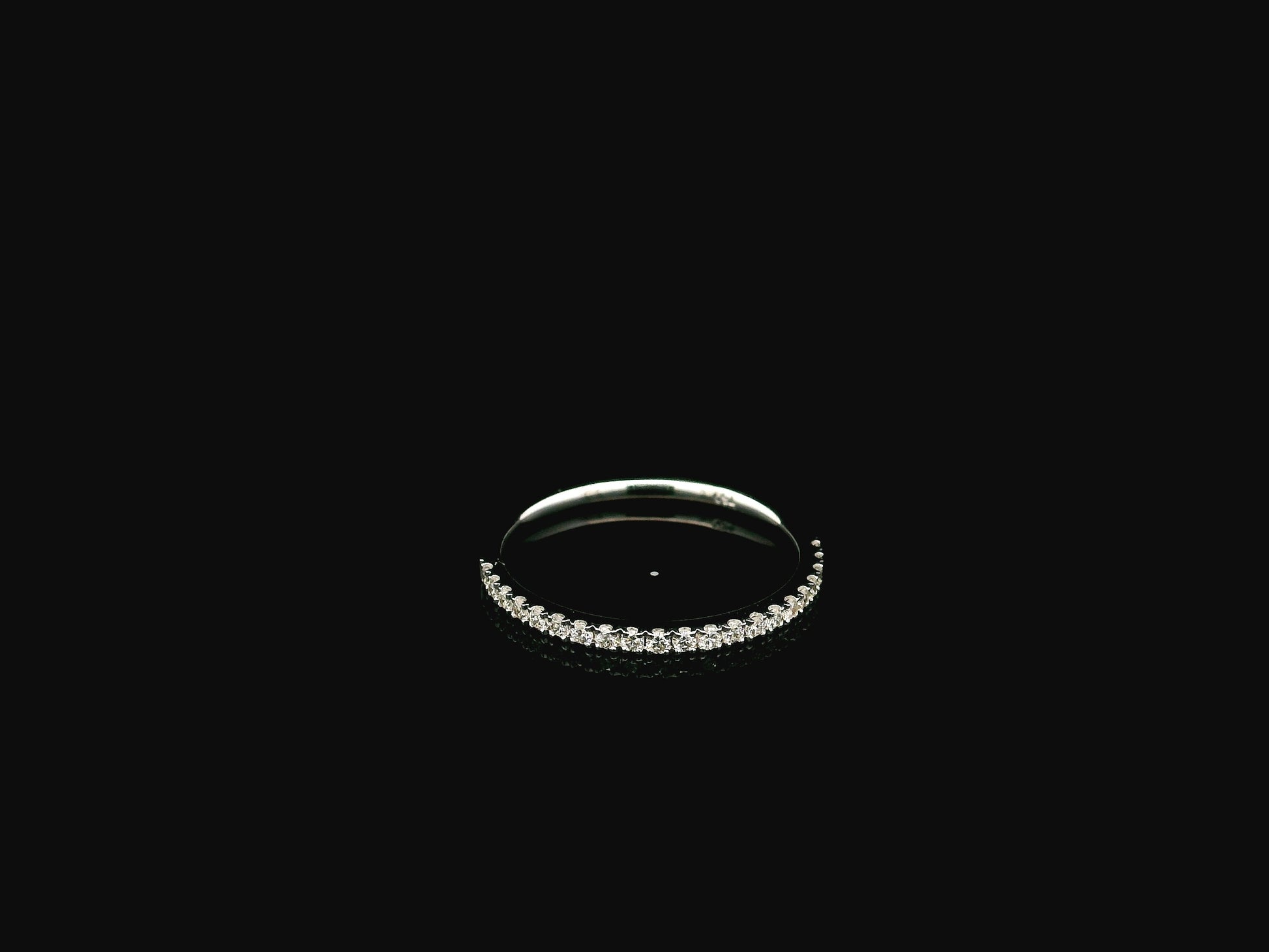 GIA certified cushion cut diamond bridal ring set in 18K white gold with halo engagement ring and matching diamond wedding band.